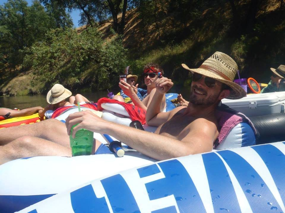 Friends rafting together on an early river trip