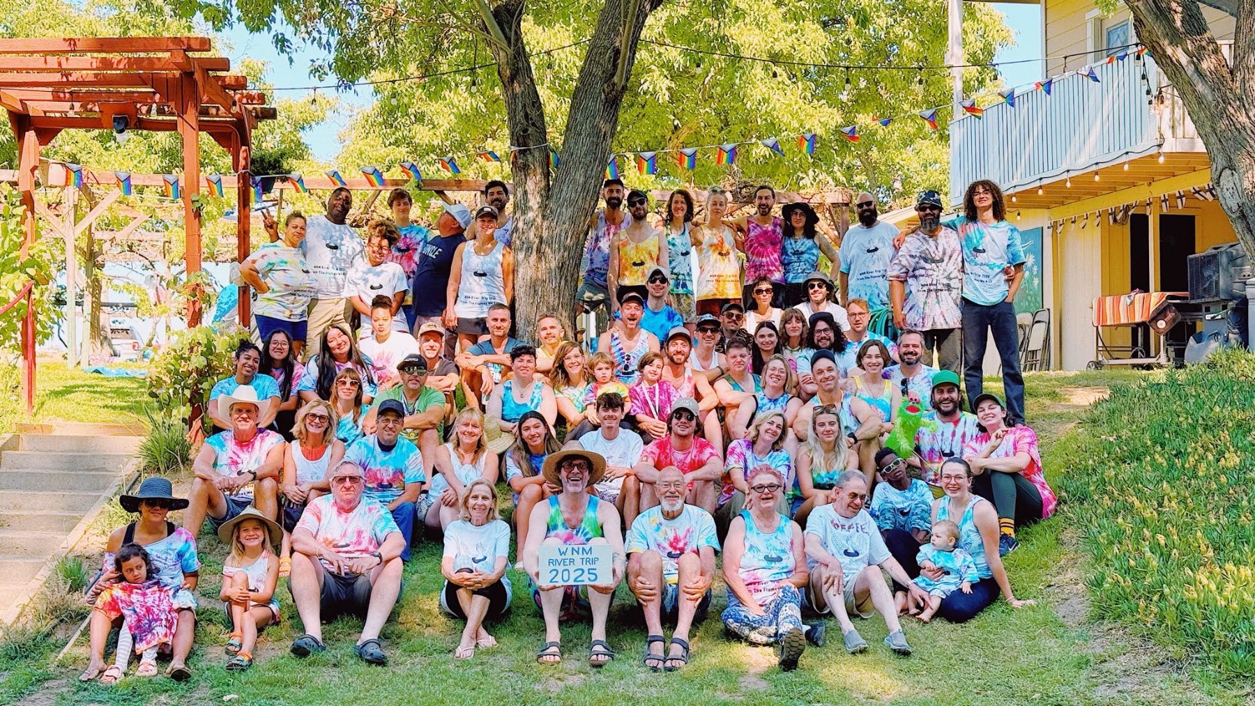 The whole WNM River Trip crew gathered under the trees at Hauli Huvila in 2025
