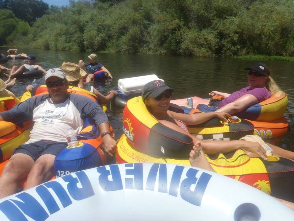 A cluster of friends rafted together in River Run tubes