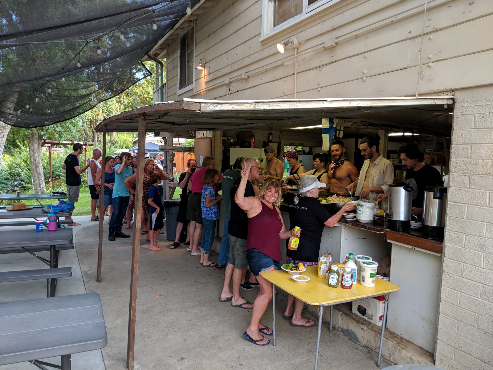 Campers lined up for a communal meal at the cooperative kitchen